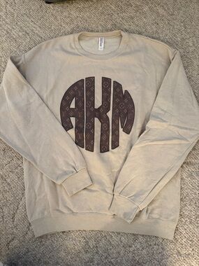 Jerzees Beige Crewneck Sweatshirt with Brown Monogram Graphic